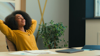 African American business woman businesswoman girl female office manager with laptop at office...
