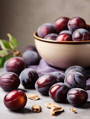 Fototapeta premium Freshly harvested organic plums in a bowl