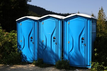 Portable toilets on mountain hiking trail in Poland