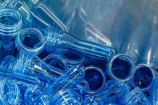 Close up scene pile of preform shape of PET bottle products.