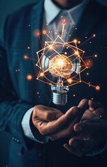 Man Holding a Glowing Lightbulb with Brain Inside