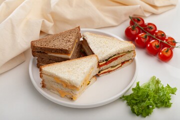 Fresh tasty sandwiches with vegetable on wooden chopping board