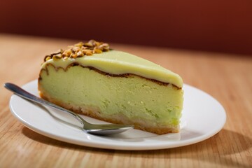 Slice of  sweet Pie with Cream on a white plate