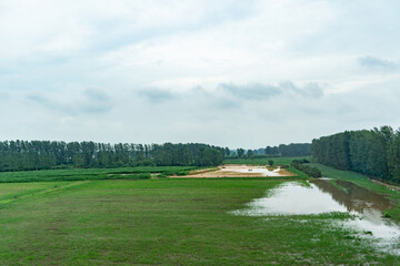 Rural grassland scenery of Taiyuan, Shanxi, with blue sky, white clouds, and fields
