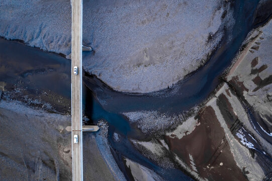 Aerial view of glacier, river, and bridge in remote Skaftarhreppur, Iceland.