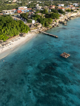 Aerial view of tropical paradise with azure waters and coastal village, Westpunt, Curacao.