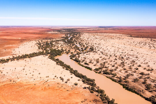 Aerial view of desert landscape with river and vegetation, Cooper Creek, Channel Country, Queensland, Australia.