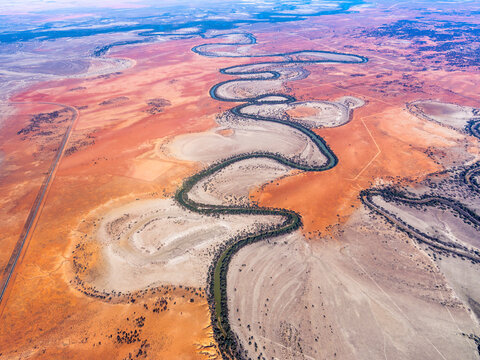 Aerial view of meandering Darling River Anabranch in dry desert landscape, Anabranch South, New South Wales, Australia.
