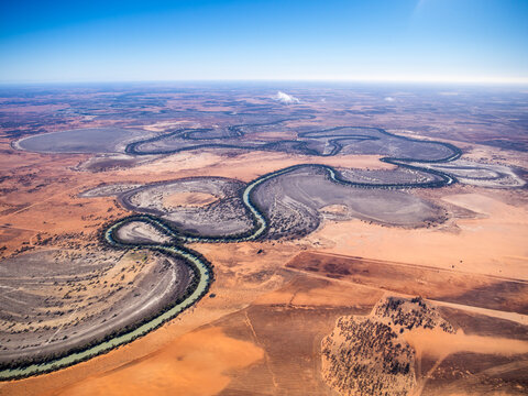 Aerial view of meandering Darling River Anabranch through dry outback desert, New South Wales, Australia.