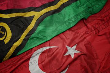 waving colorful flag of Vanuatu and national flag of turkey on the dollar money background. finance...