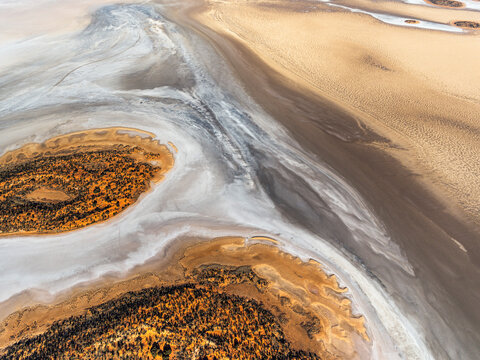 Aerial view of Lake Amadeus, salt lake in desert landscape, Petermann, Northern Territory, Australia.