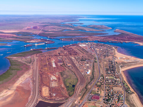Aerial view of Port Hedland with ships loading iron ore for export, Western Australia, Australia.