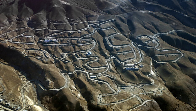 Aerial view of winding road through mountainous landscape, Kashmir region, Pakistan.