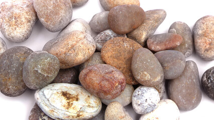 Pebbles piled on white background