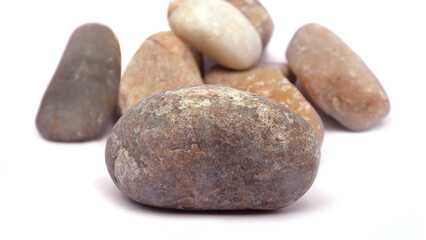 Pebbles piled on white background
