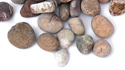 Pebbles piled on white background