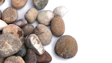 Pebbles piled on white background