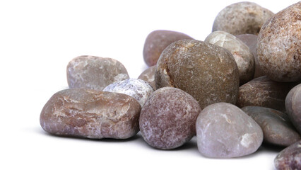Pebbles piled on white background