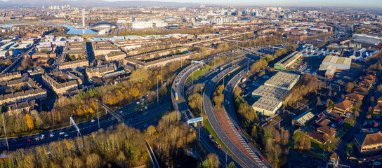 Aerial view of urban Glasgow skyline with highways and residential buildings, Bellahouston, Scotland, United Kingdom.