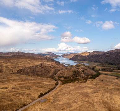 Aerial view of Loch Ailort with road, hills, water, and sky, Lochailort, Scotland, United Kingdom.