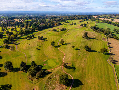 Aerial view of Portal Golf Course surrounded by lush green landscape, Tarporley, England.
