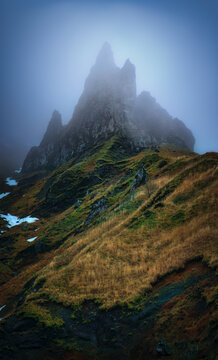 Aerial view of fog-covered mountain peak in Mont Dore, Auvergne, France.