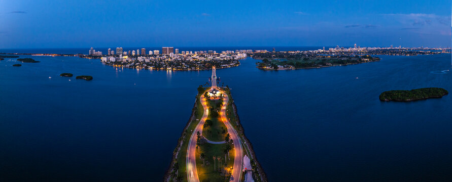 Aerial view of North Miami skyline at night over Biscayne Bay, Florida, United States.
