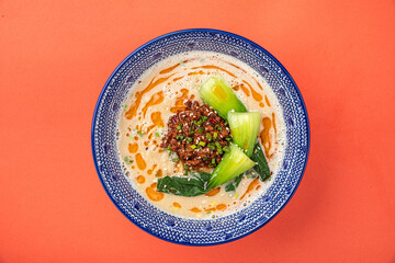 Portion of appetizing japanese tantanmen ramen with bok choy