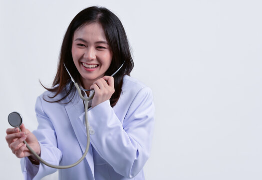 The butiful Asian female doctor while working in the hospital