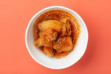 Portion of fried japanese shichimi togarashi chicken wings