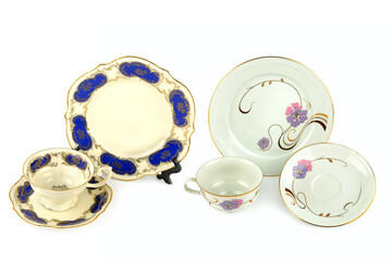 Vintage porcelain cups and saucer isolated on white. Collage.