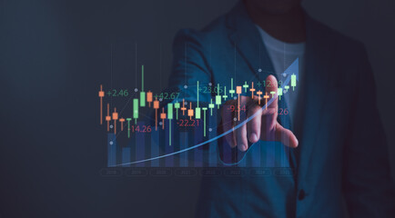 trader or Investor touching stock candlesticks with virtual screen, concept of investment planning and strategy stock market, mutual fund, bonds, digital assets, gold or debt instrument