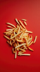 Pile of French Fries on Red Background