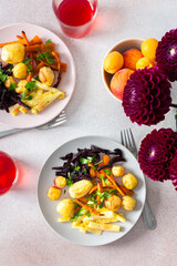 Enjoy a healthy and delicious breakfast or lunch featuring baked vegetables such as potatoes, zucchini, carrots, and beets, complemented by fresh fruits and cherry compote