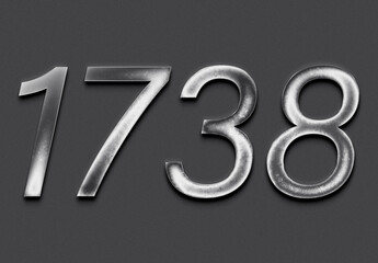 Chrome metal 3D number design of 1738 on grey background.