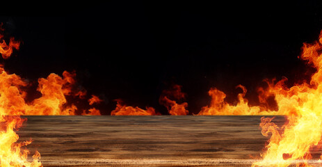 Burning flames with copy space for hot spicy products and food concept on wooden table and black...