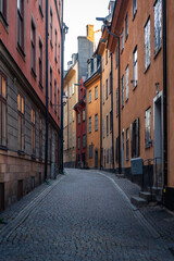 Fototapeta premium Narrow cobblestoned street in Stockholm Old Town during summer