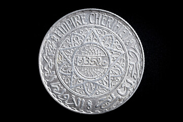 Silver coin of 10 francs 1934 from Morocco with decorative reliefs. Numismatics and collecting