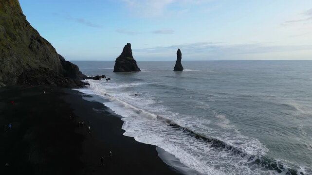 Aerial top view of wave of Black Sand Beach Reynisfjara in Iceland.
