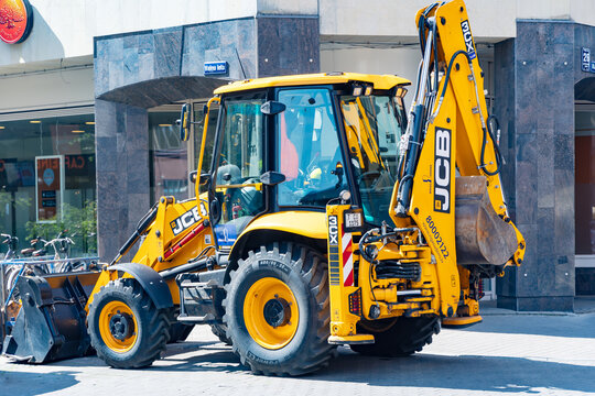 LATVIA, RIGA, 28, JULY, 2024: JCB 4CX-14 Super Backhoe Loader at city works in the center of Riga Old Town, Latvia.