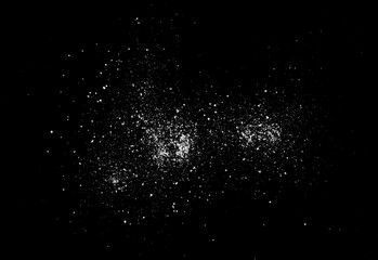 Sea ​​salt grains, crystals scattered isolated on black background, top view
