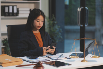 Judge gavel with Justice lawyers having team meeting at law firm background. Concepts of Law and...