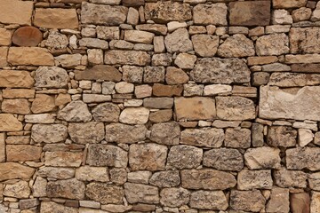 Fototapeta premium Old stone wall rough edges background