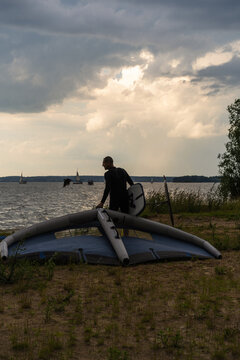 Wingfoil rider riding in the lake.