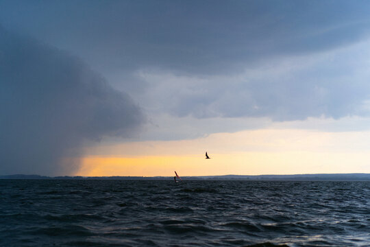 Wingfoil rider riding in the lake.