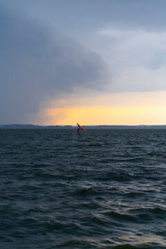 Wingfoil rider riding in the lake.