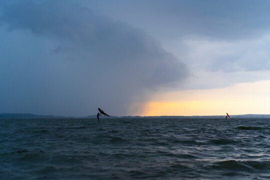 Wingfoil rider riding in the lake.