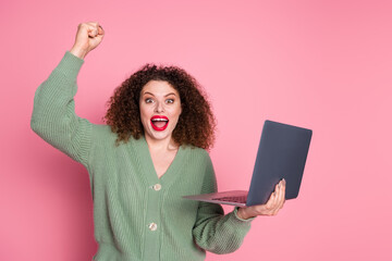 Photo of charming cheerful glad woman wear stylish khaki clothes buy modern device isolated on pink color background