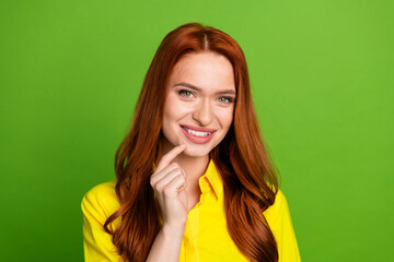 Photo portrait of attractive young woman curious interested dressed stylish yellow clothes isolated on green color background