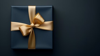 A black box with gold ribbon on top